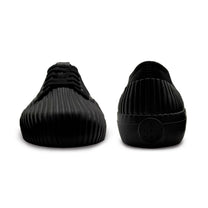 Front and back view of UNFORMED black canvas low-top sneakers