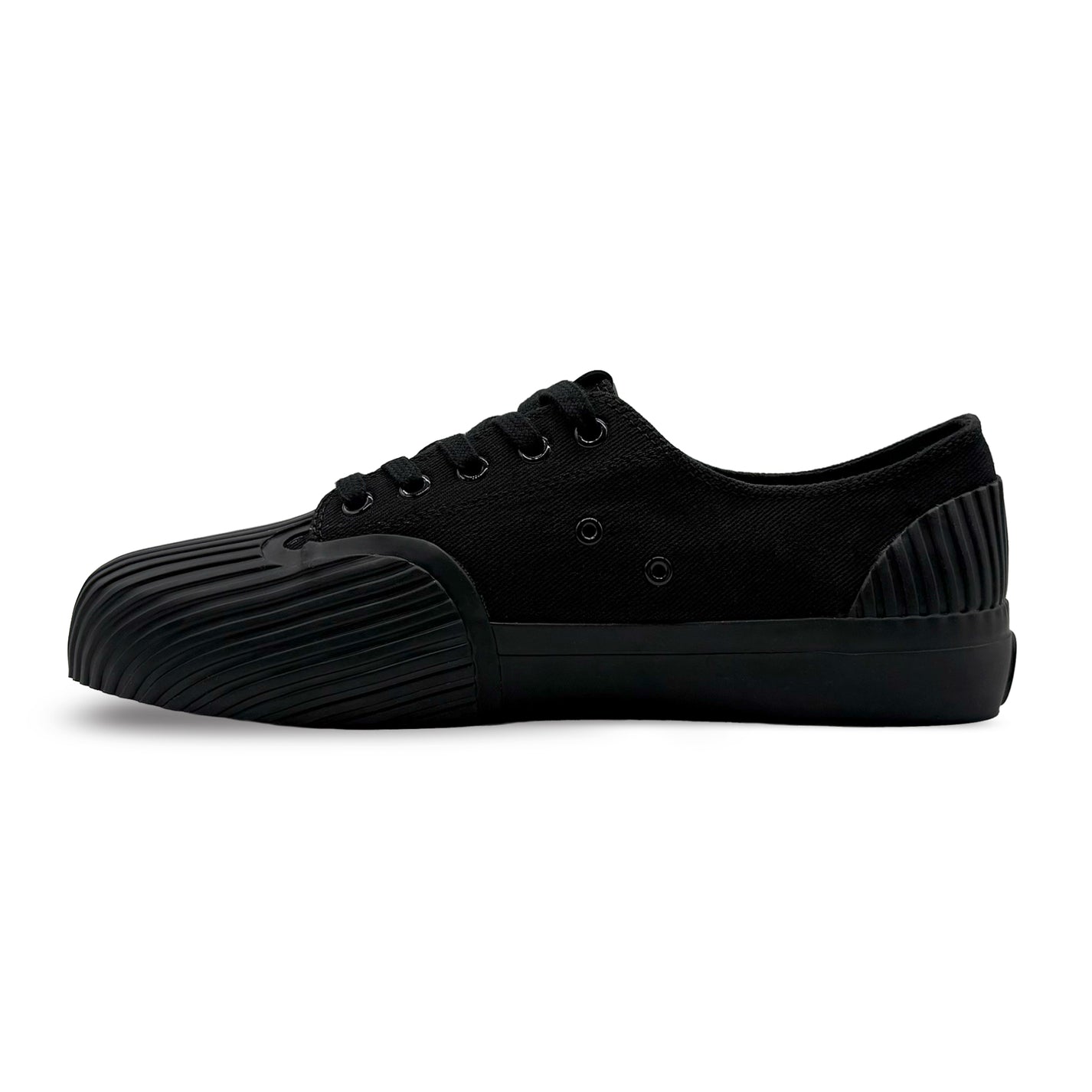 Side view of UNFORMED black canvas low-top sneakers