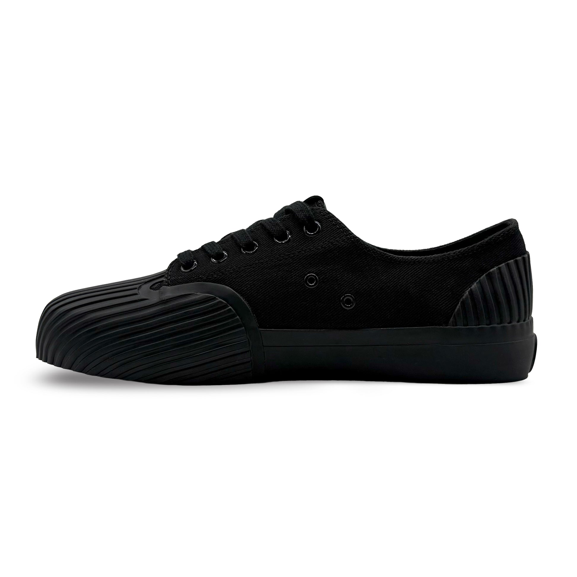 Side view of UNFORMED black canvas low-top sneakers
