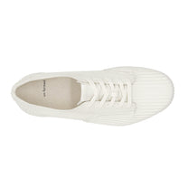 Top view of UNFORMED white canvas low-top sneakers