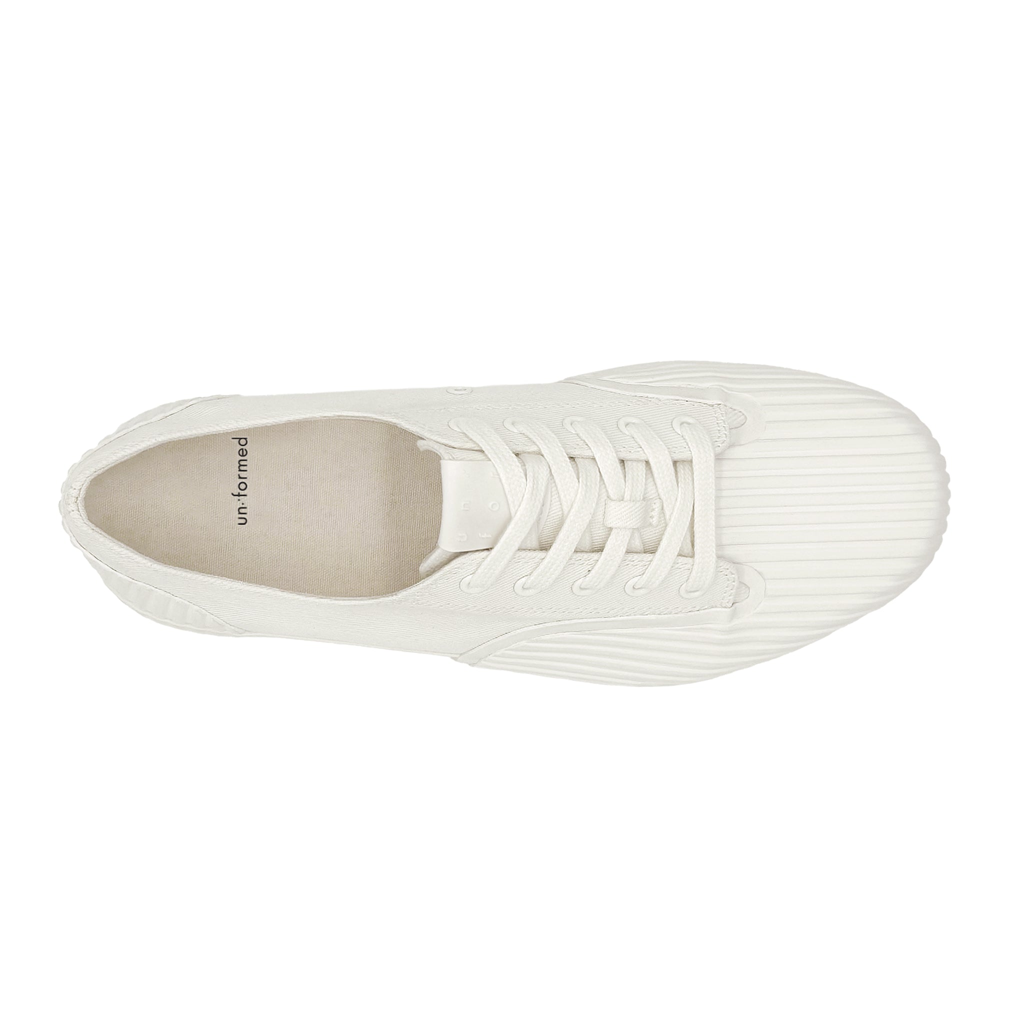 Top view of UNFORMED white canvas low-top sneakers