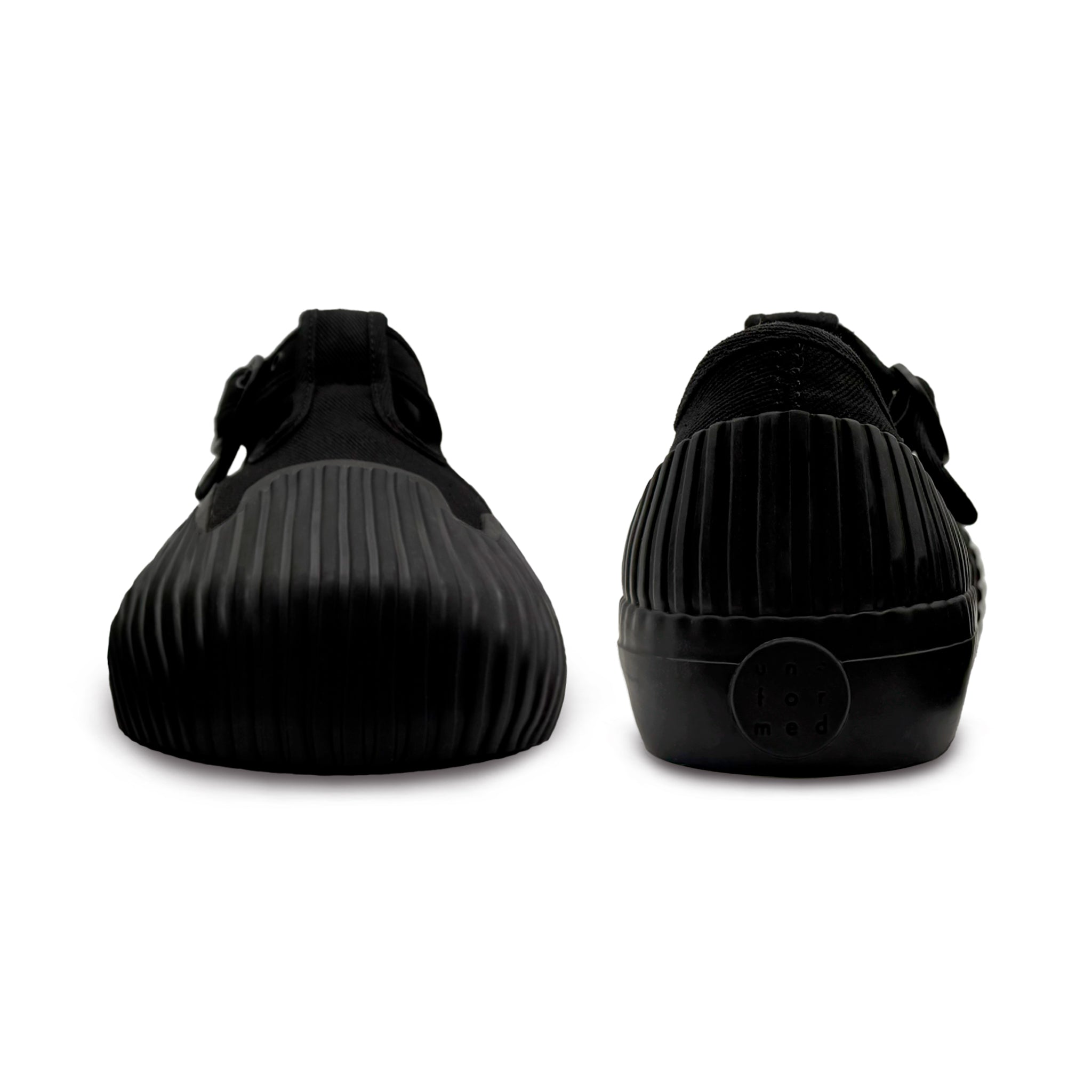Front and back view of UNFORMED black canvas low-top sneakers
