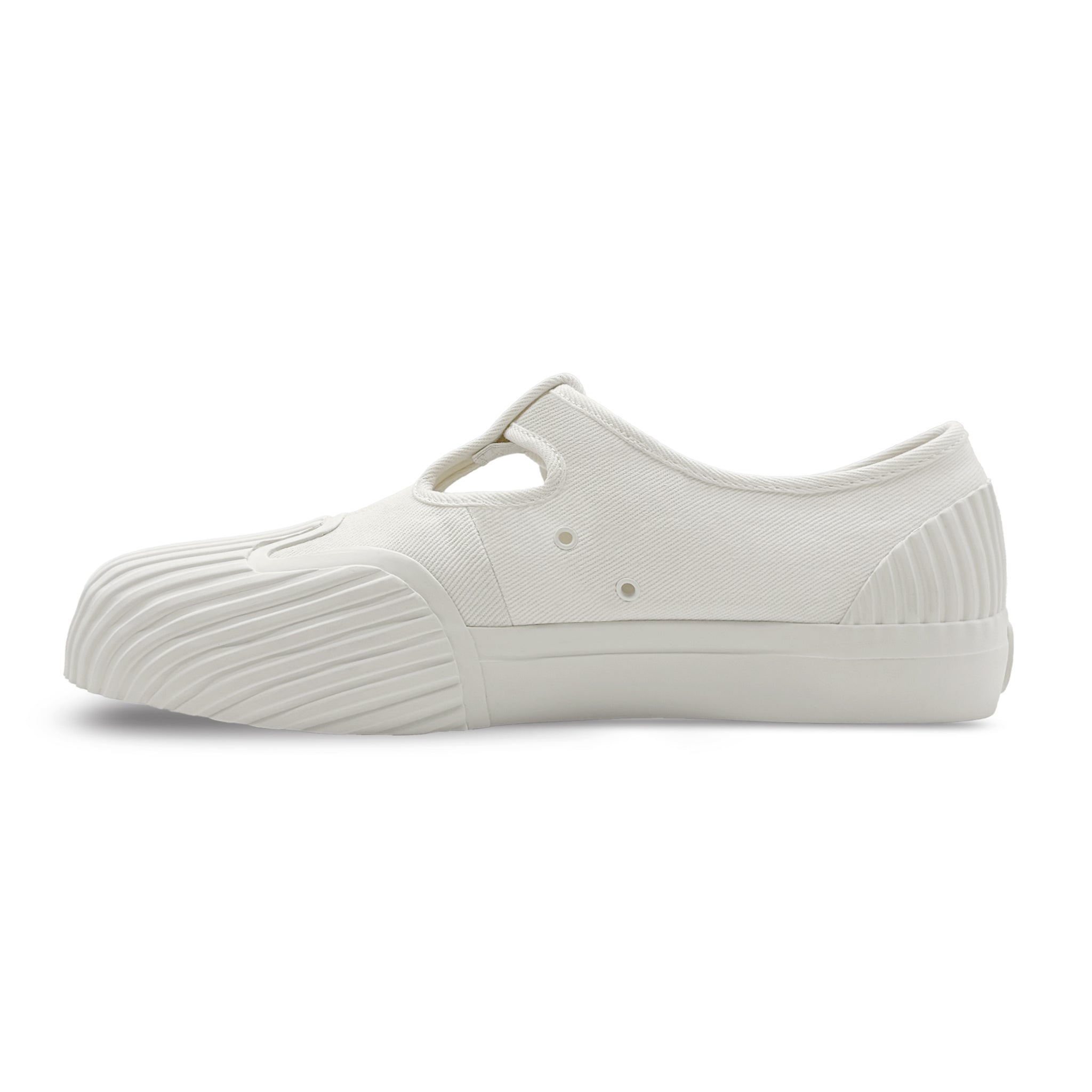 Side view of UNFORMED white canvas T-strap sneakers