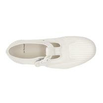 Top view of UNFORMED white canvas T-strap sneakers